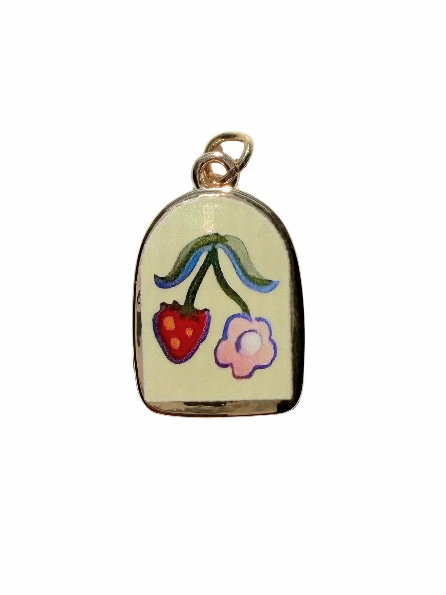 Enamel pendant with strawberry and flower design on a white background