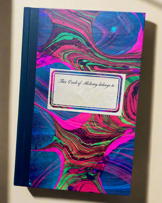 Notebook with colorful marbled design and label on a white background
