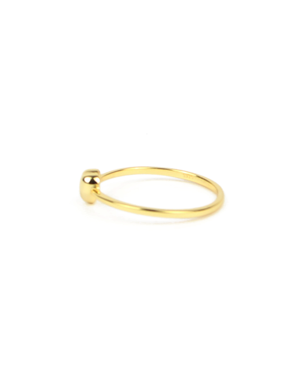 Gold ring on a white background