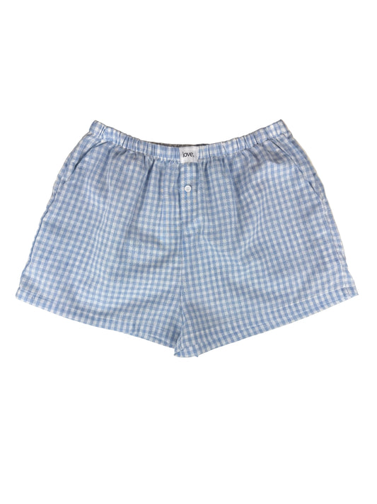 Blue and white checkered shorts on a white background