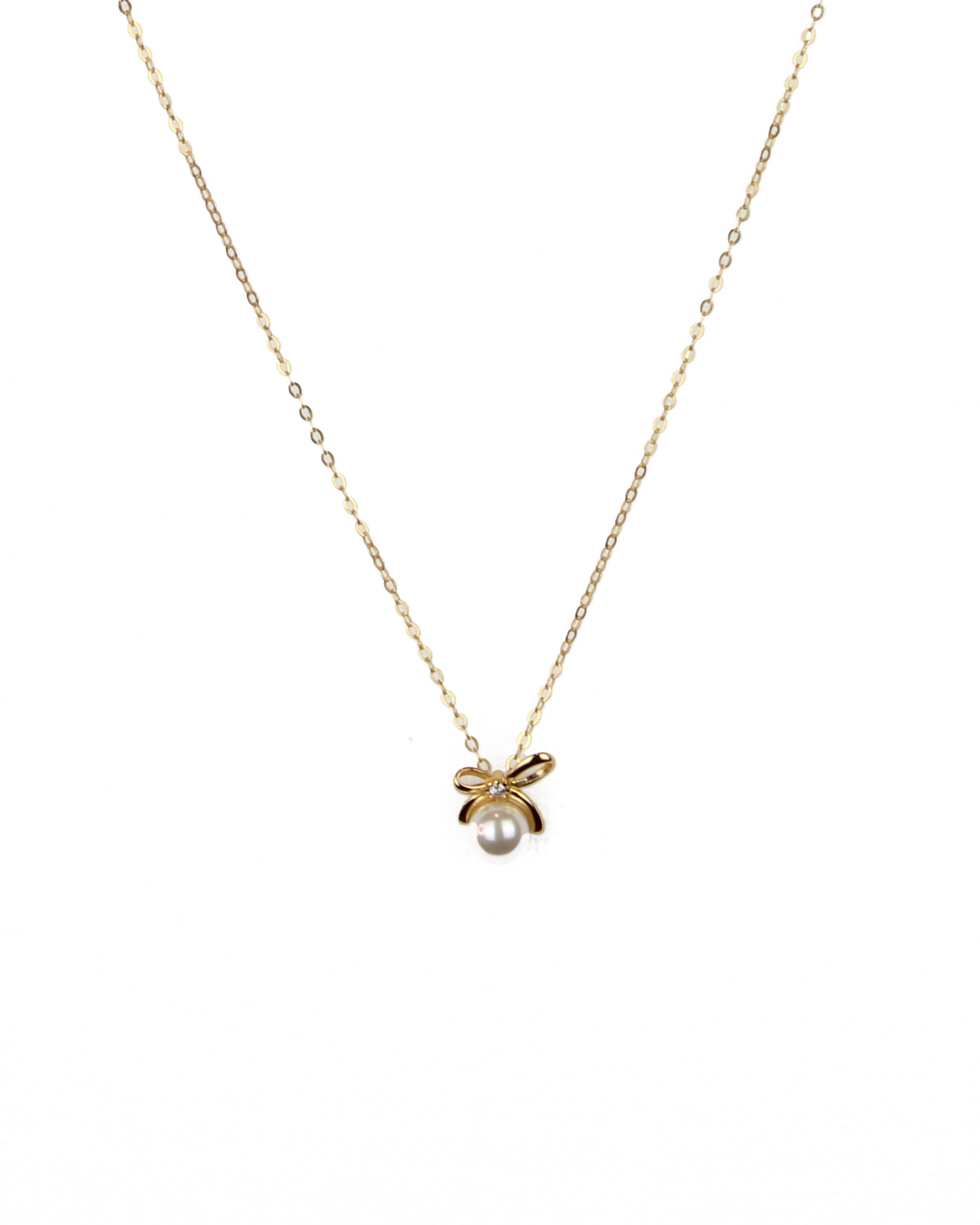 Gold necklace with a small pendant on a white background