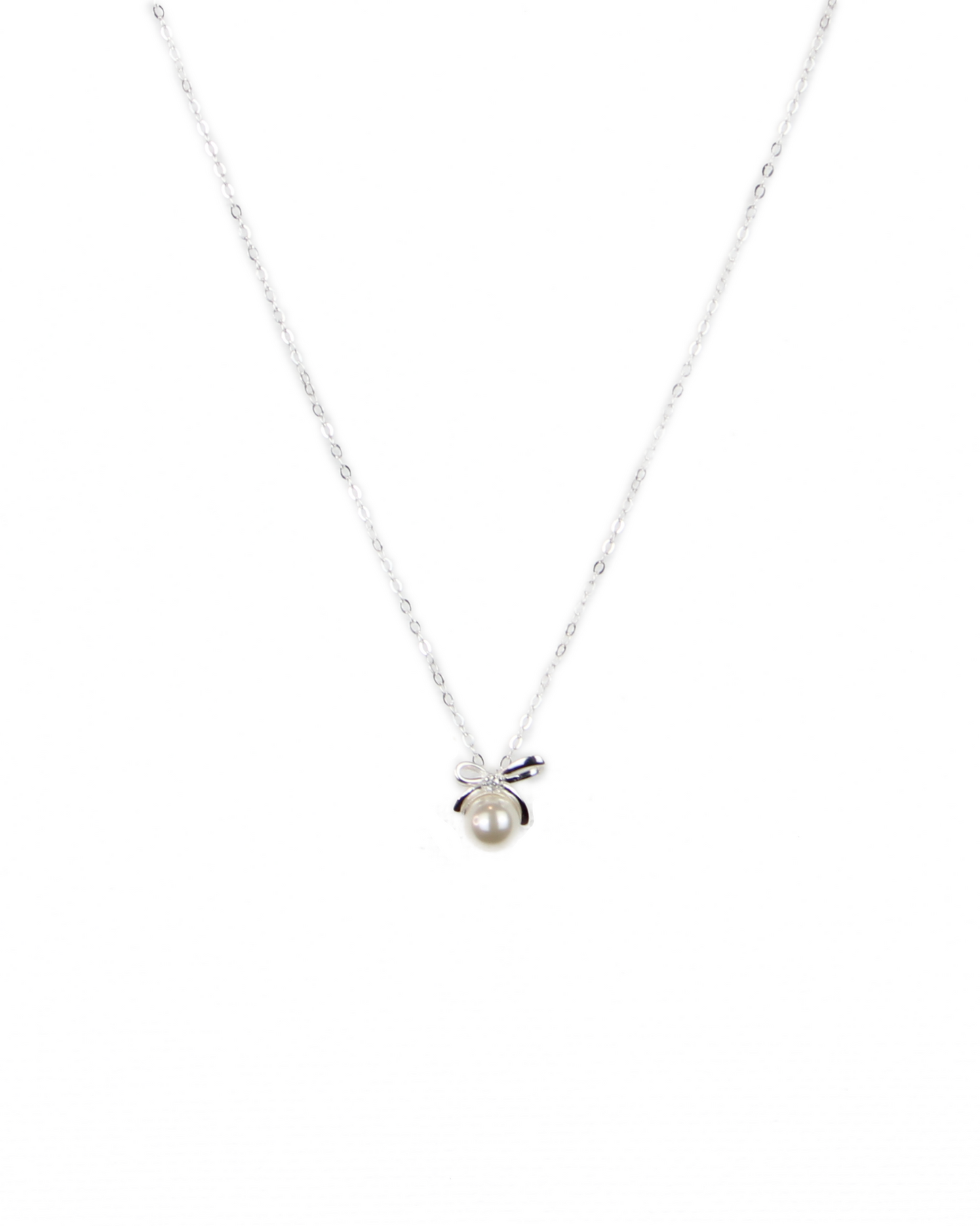 Silver necklace with a small pendant on a white background