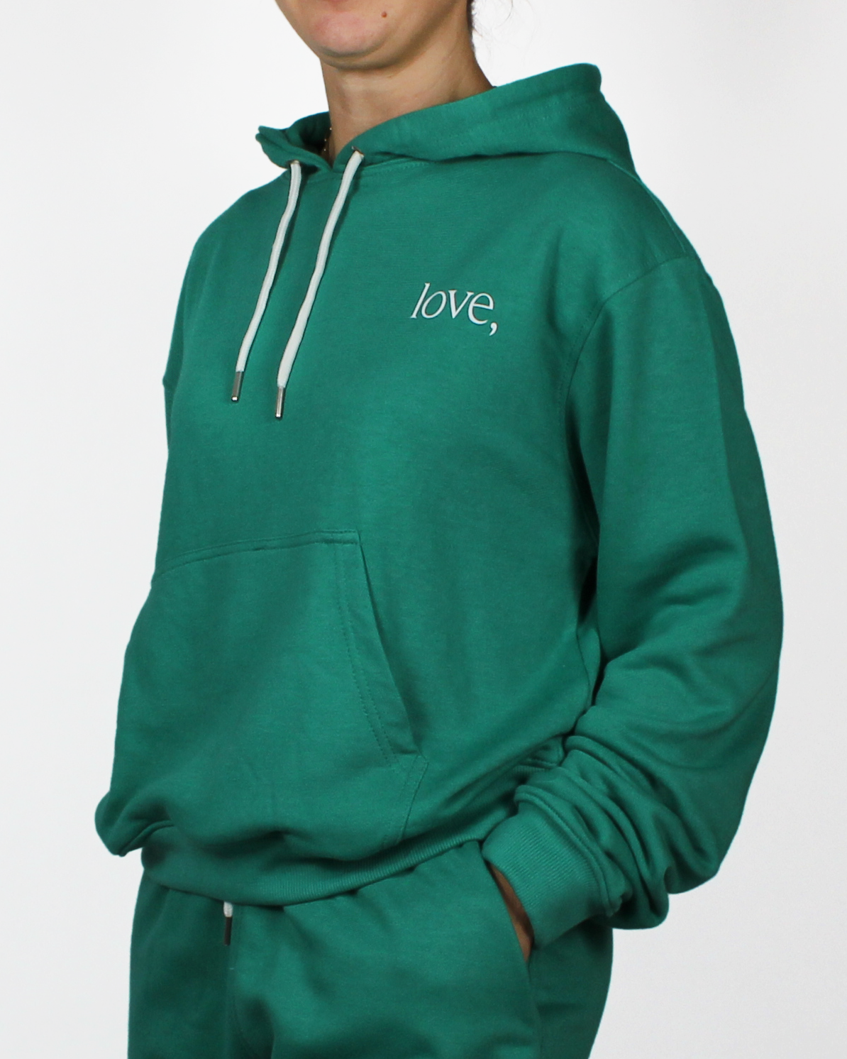 Green hoodie with 'love,' text on a white background