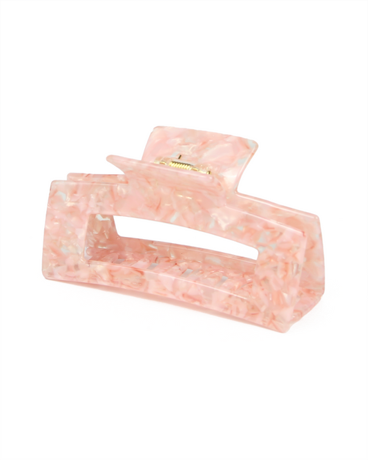 Pink marble hair clip on a white background