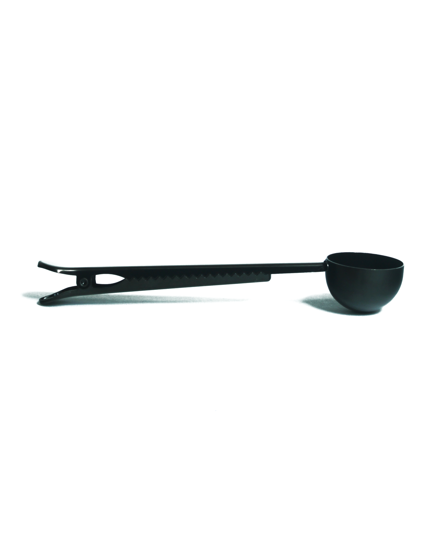 Black coffee scoop on a white background