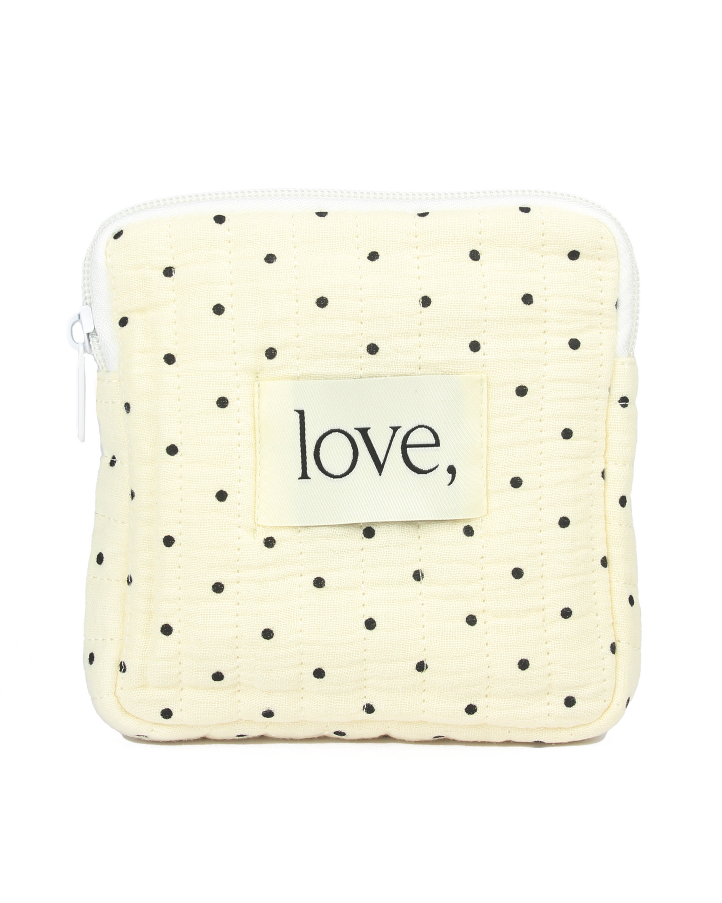 Small pouch with polka dot pattern and 'love' label on a white background