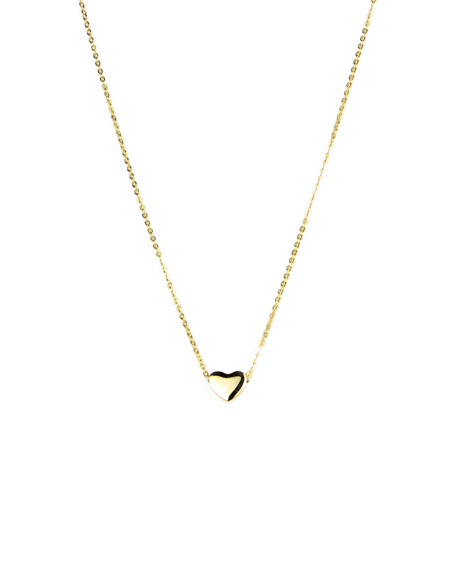 necklace with a heart bead on a gold chain on a white background