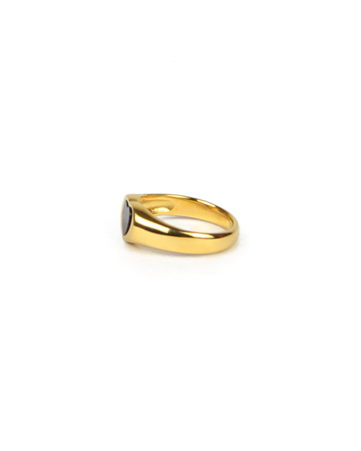 Gold ring with black enamel on a white background