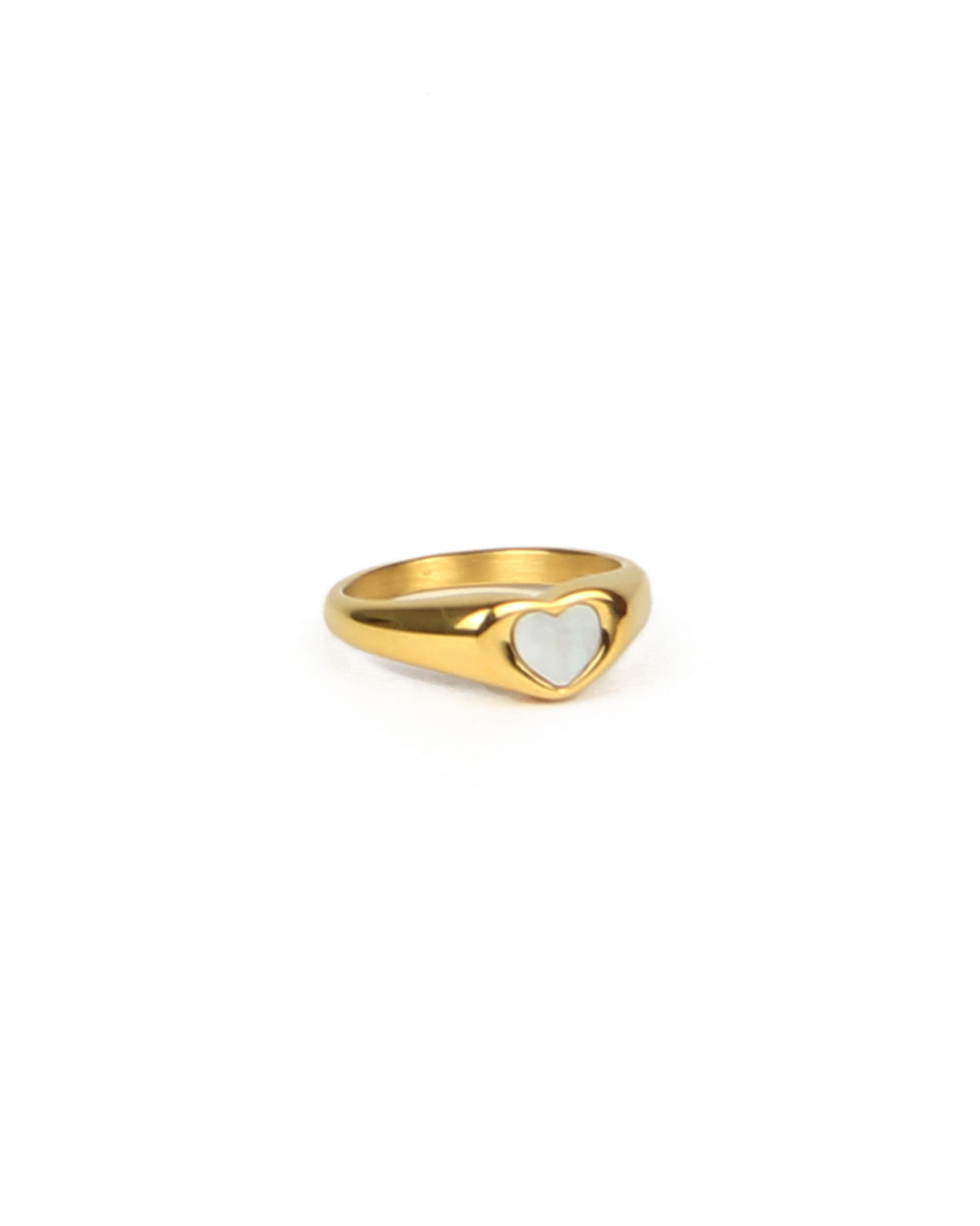 Gold ring with a heart-shaped center on a white background