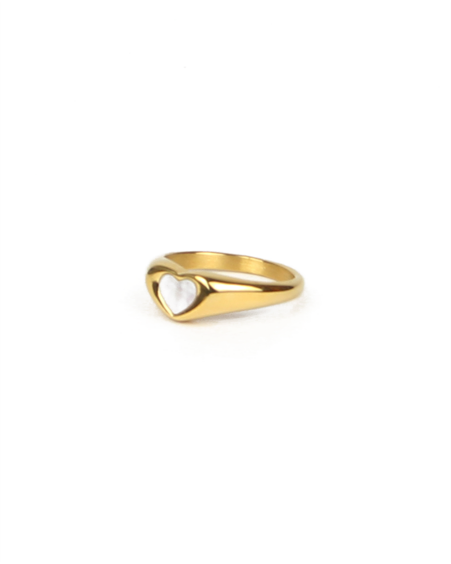 Gold ring with a heart design on a white background