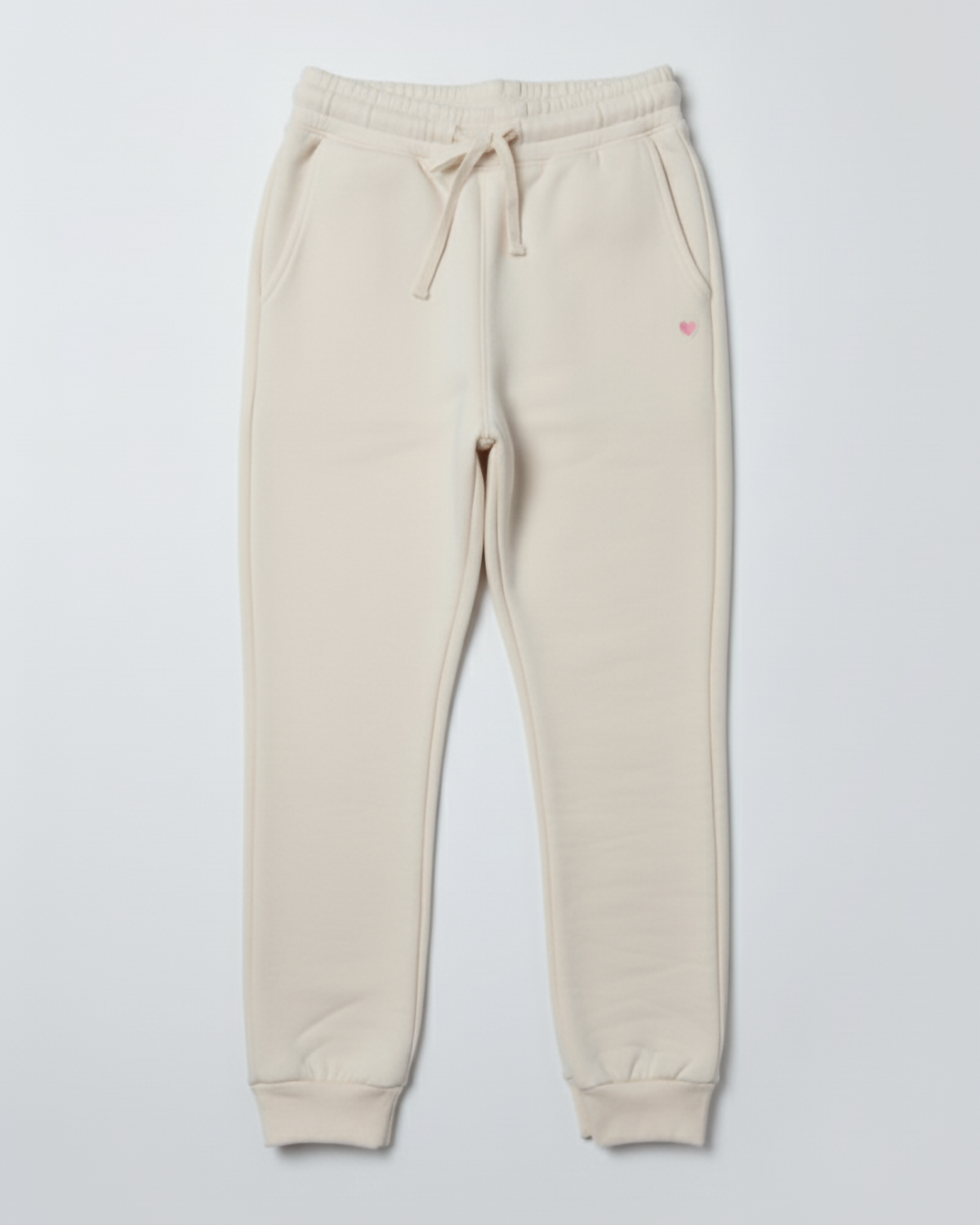 Beige sweatpants with a small red logo on a light gray background