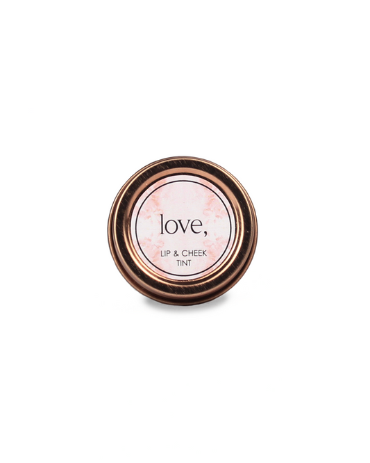 Lip and cheek tint container with 'love' branding on a white background