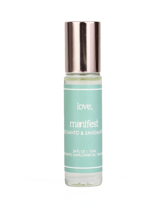 Small bottle of 'love, manifest' oil with a silver cap on a white background