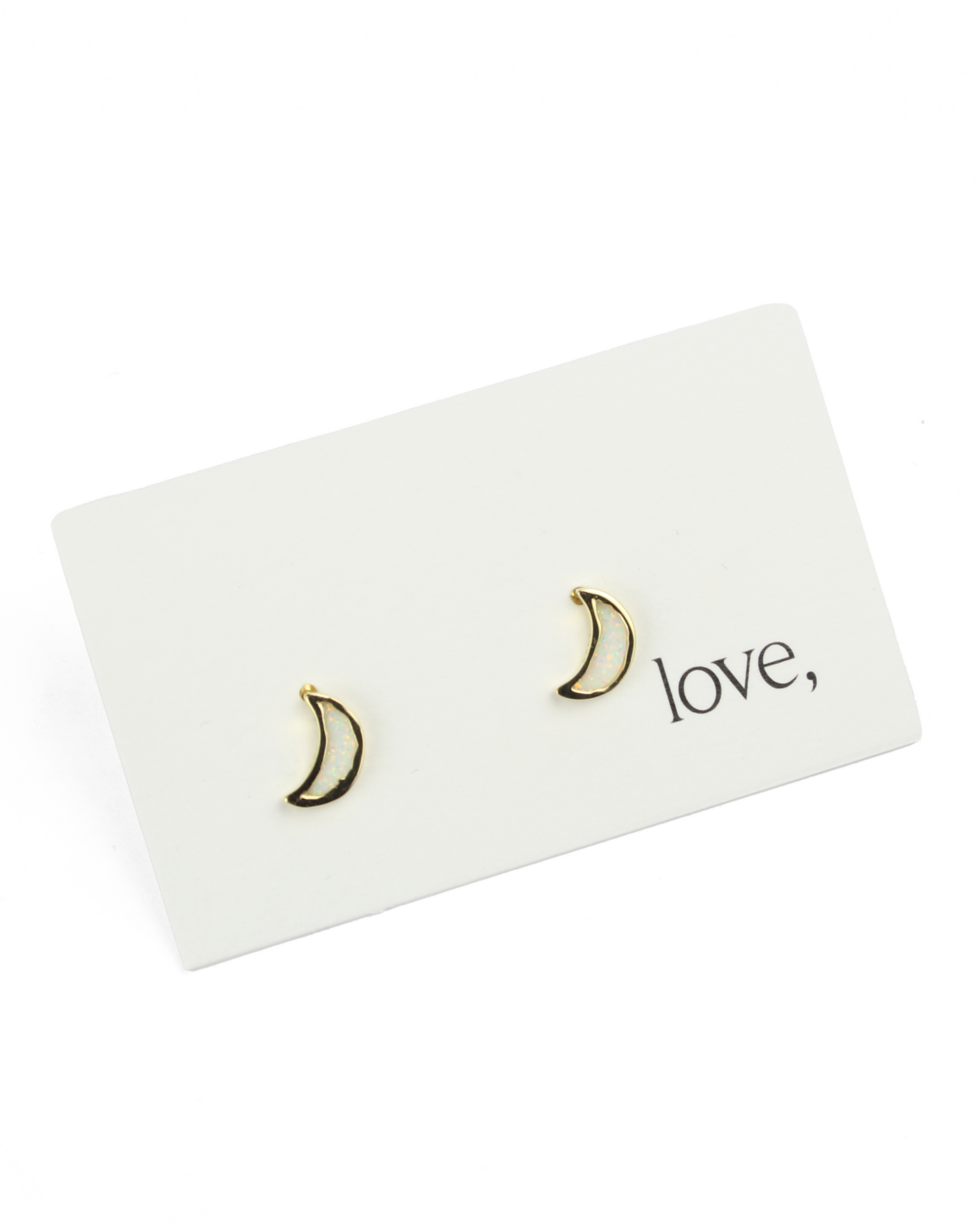 moon earrings on a card on a white background