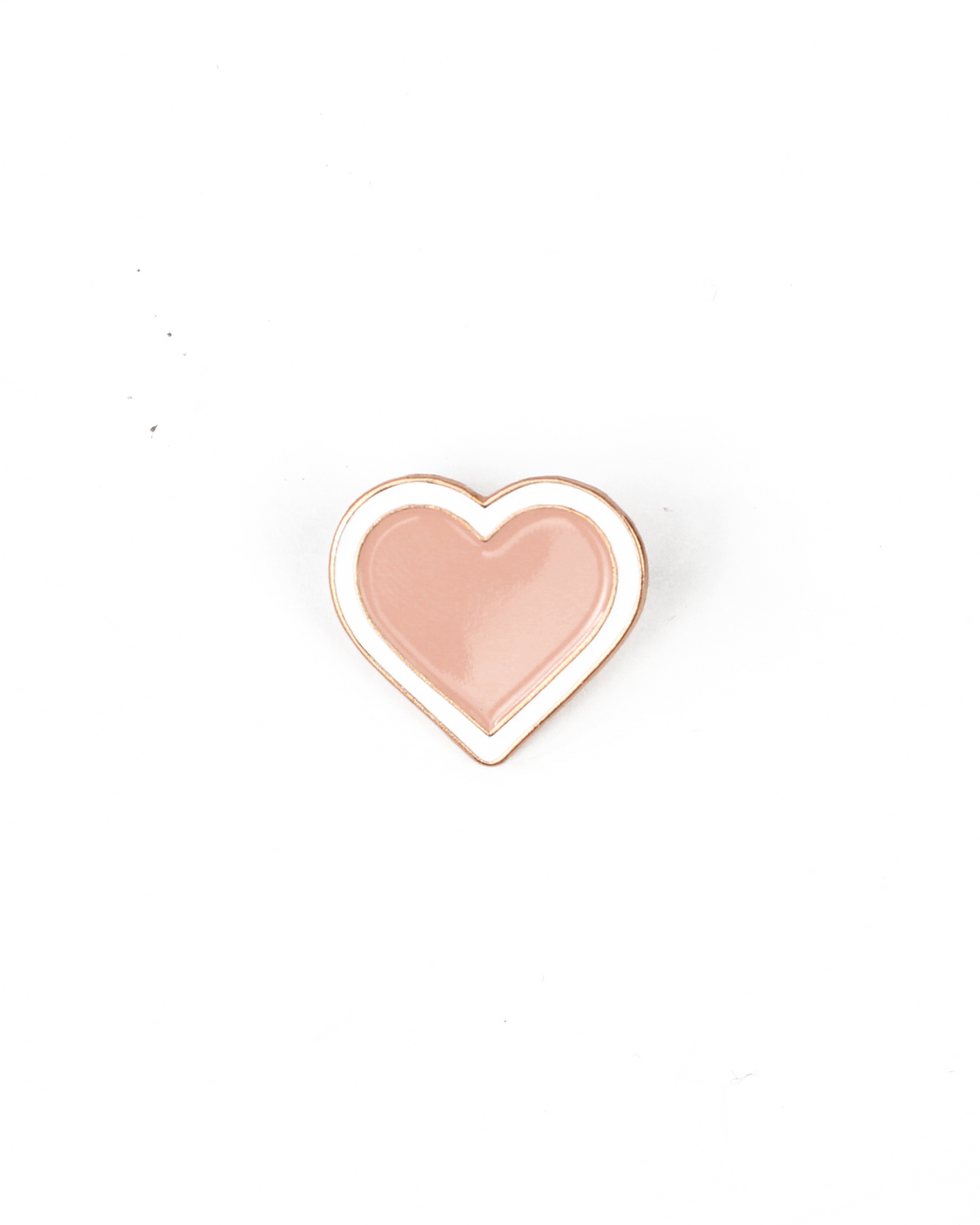 Heart-shaped pin with a pink center and gold outline on a white background