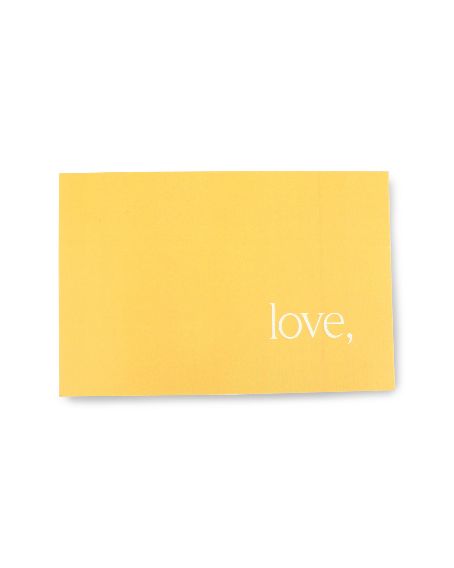 Yellow card with 'love,' text on a white background