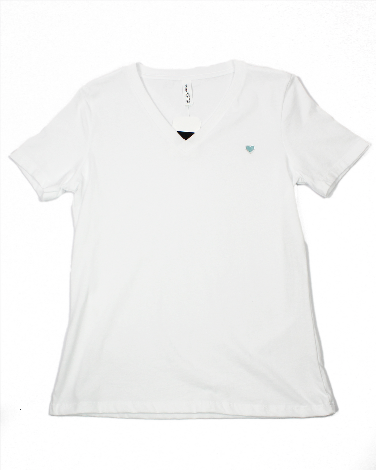 white vneck tee with heart patch on chest