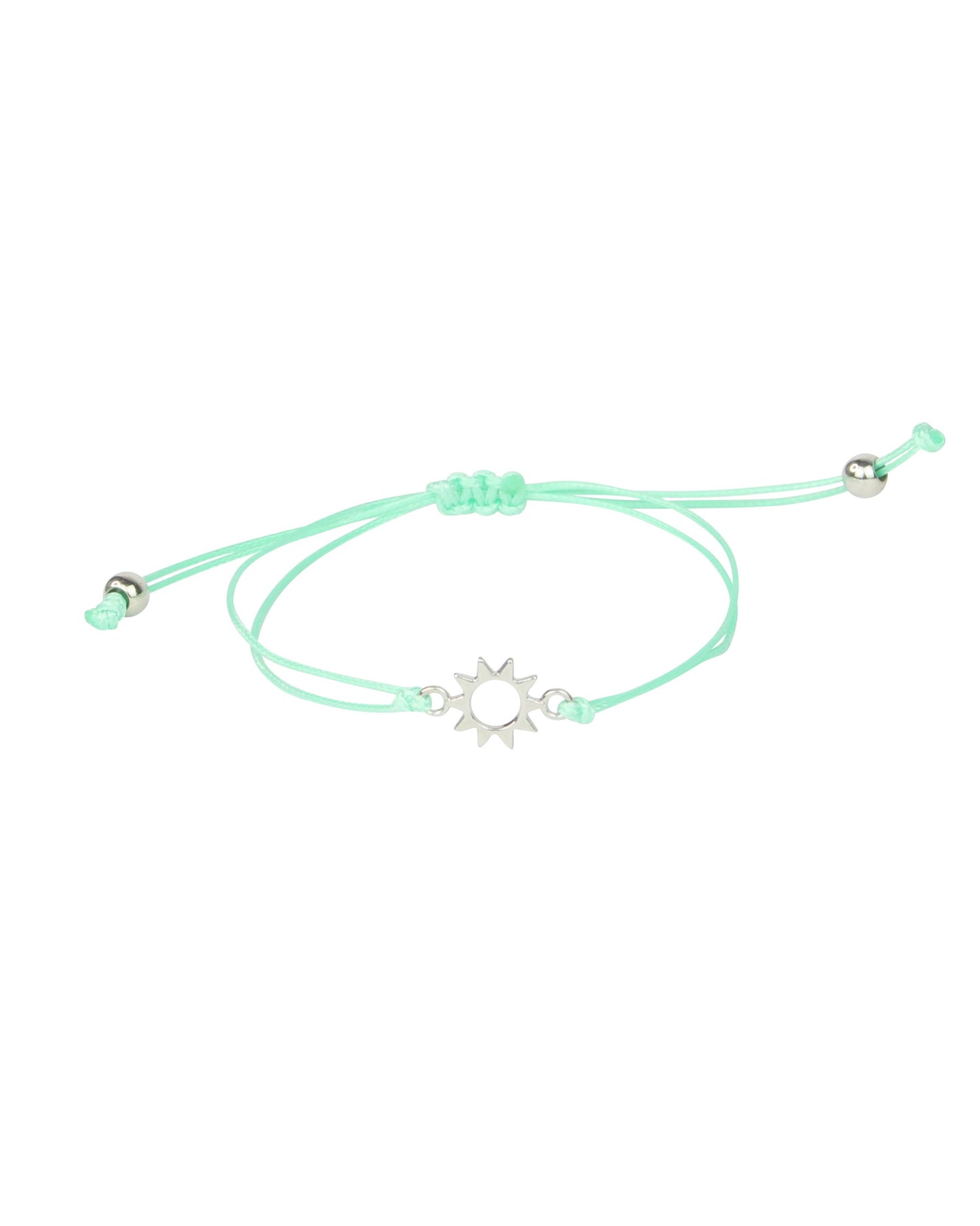 Mint green bracelet with a silver sun charm on a white background