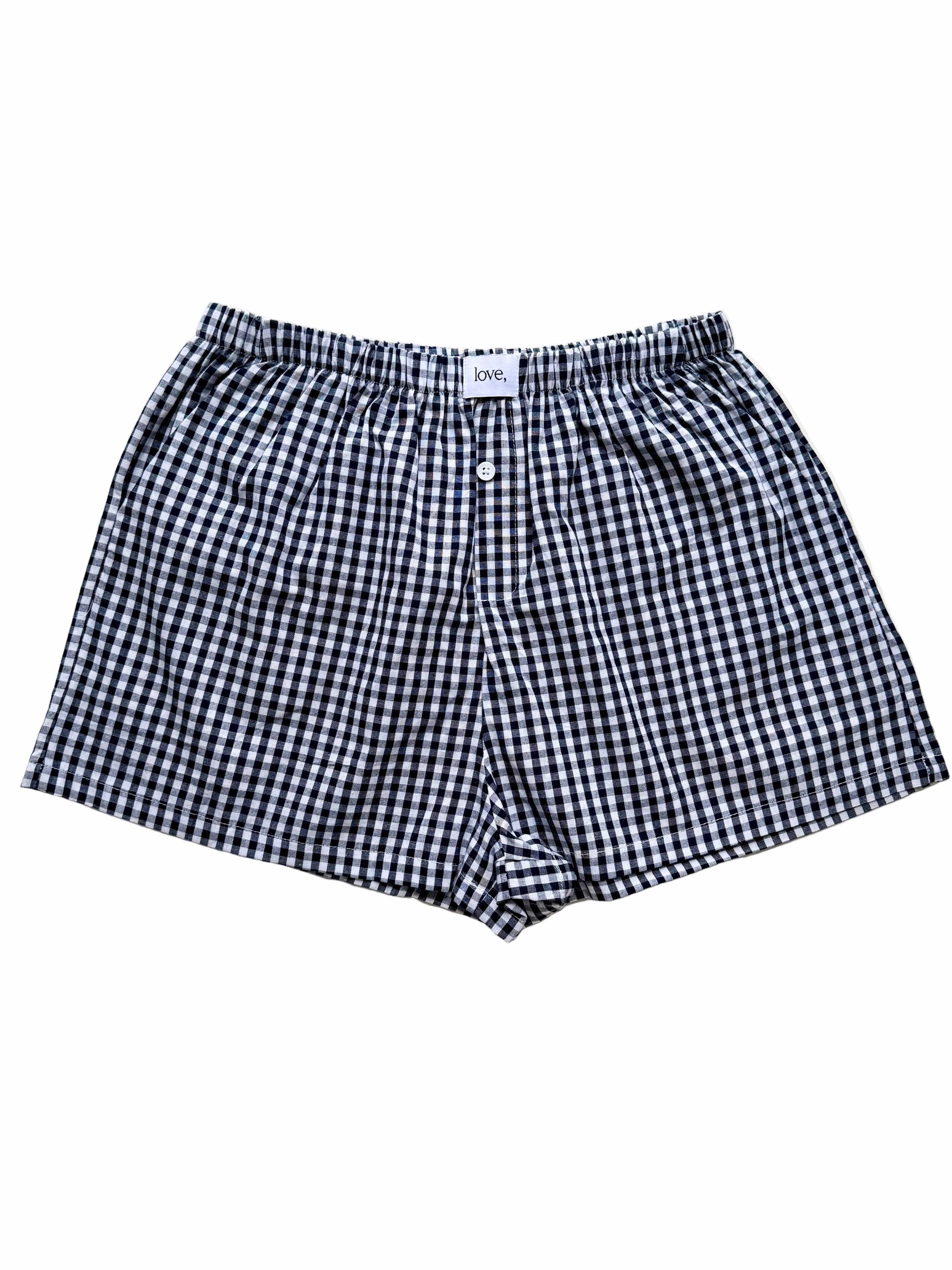 Black and white checkered boxer shorts on a white background