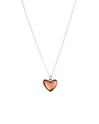 Necklace with a pink heart pendant on a white background