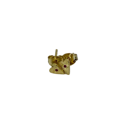 Gold heart-shaped earrings with red gemstones on a light gray background