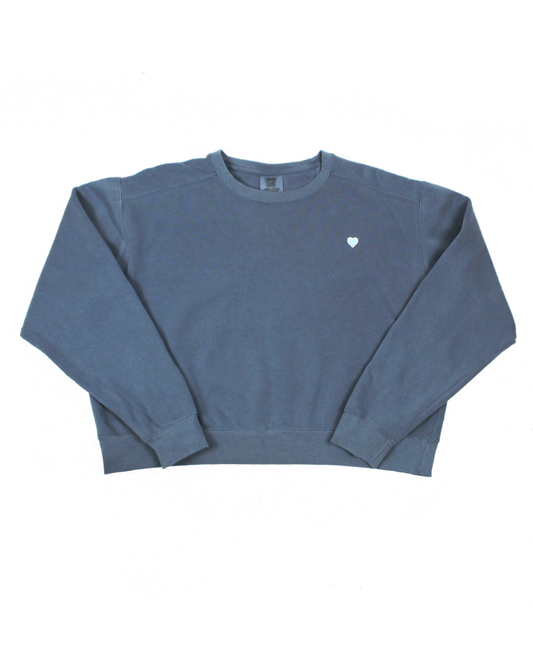 blue sweatshirt with blue heart patch on white background