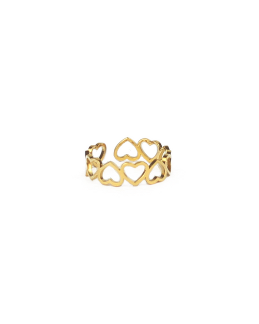 Gold ring with heart designs on a white background