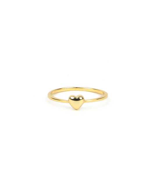 Gold ring with a heart-shaped design on a white background