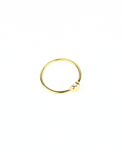 Gold ring on a white background