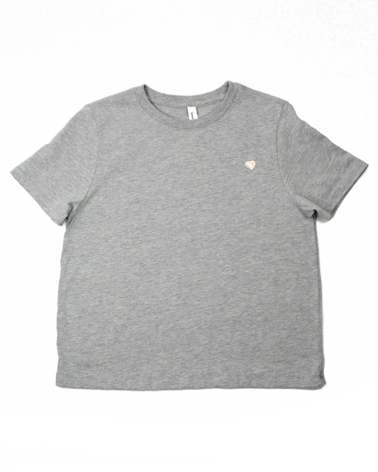Gray t-shirt with a small heart design on a white background