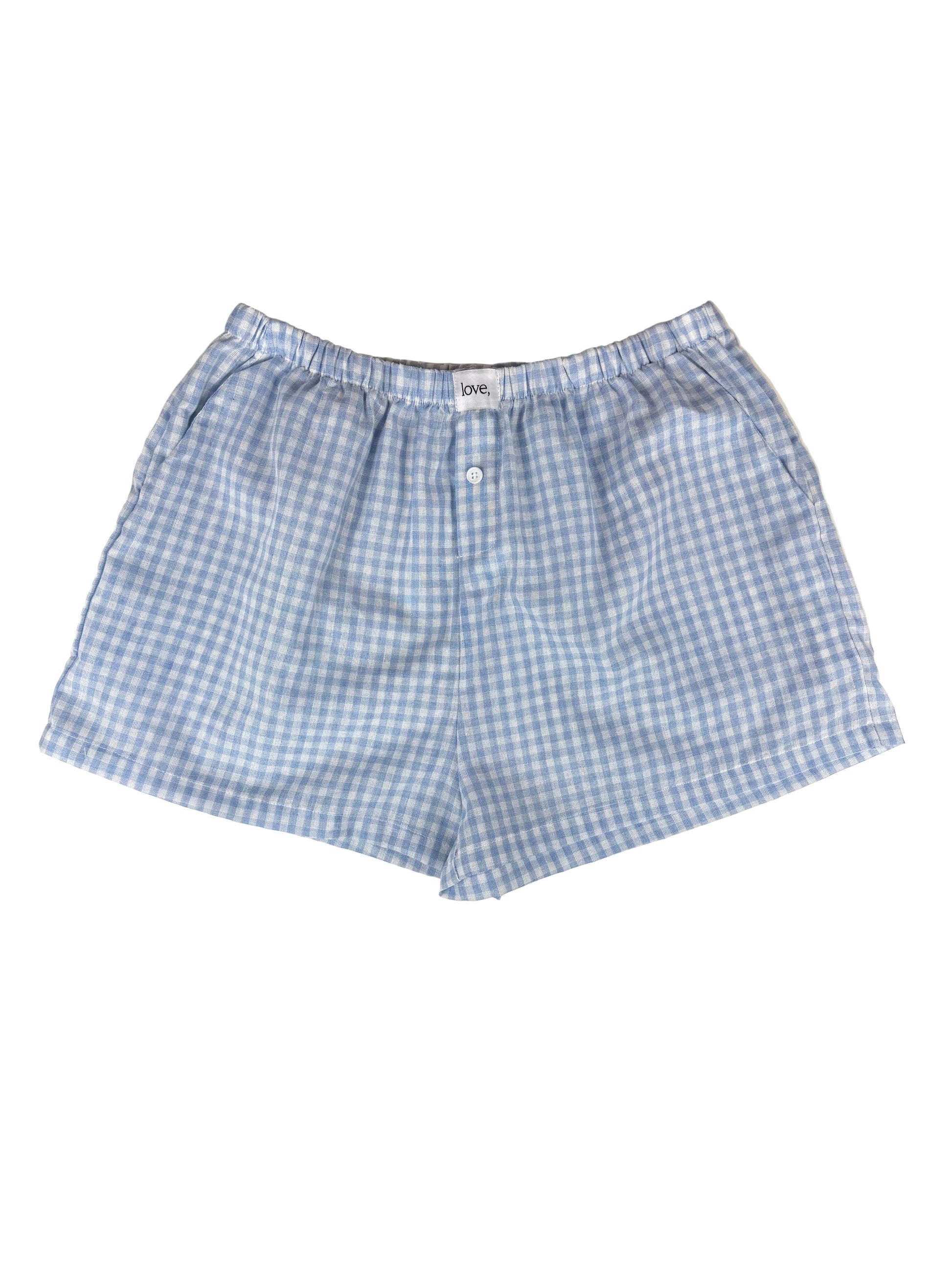 Blue and white checkered shorts on a white background