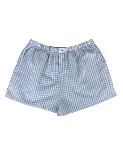 Blue and white checkered shorts on a white background