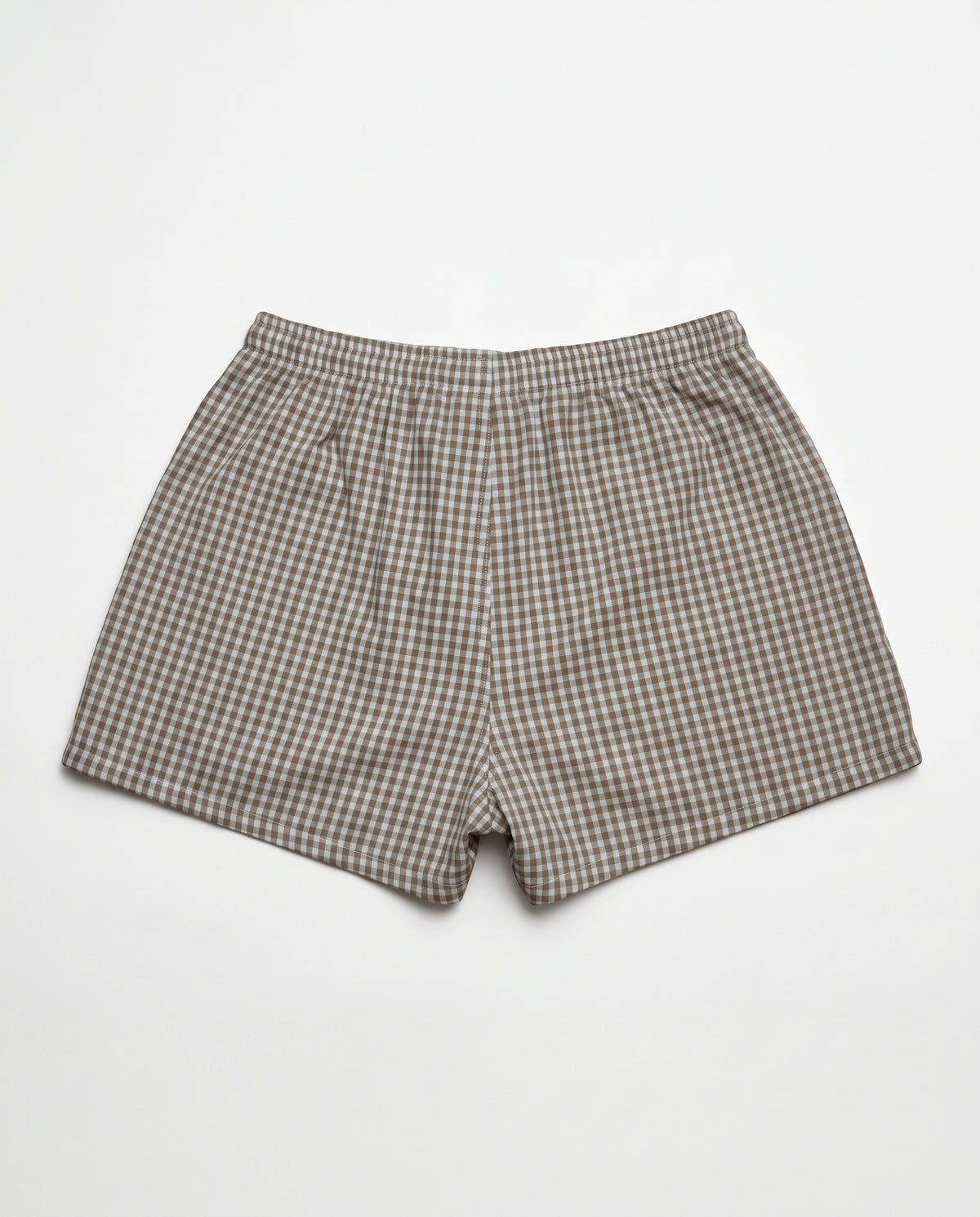 A pair of men's boxer shorts featuring a brown and beige gingham checkered pattern, laid flat against a light gray background.