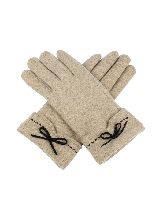 Pair of beige gloves with black bow details on a white background