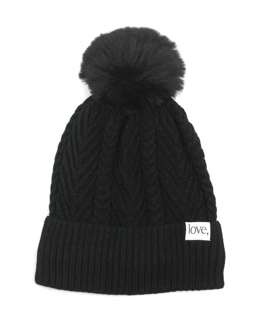 black pom beanie on a white background