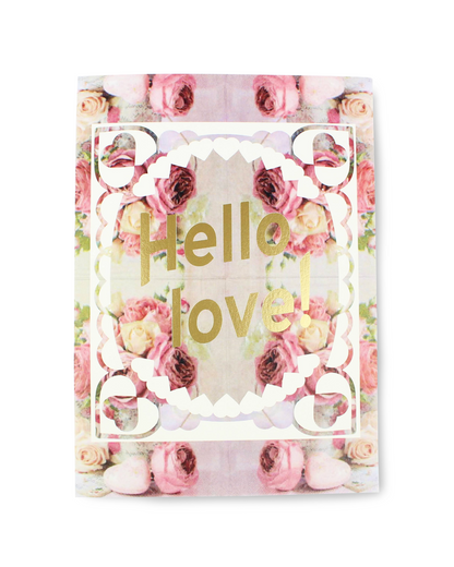 Floral notebook with 'Hello love!' text on a white background