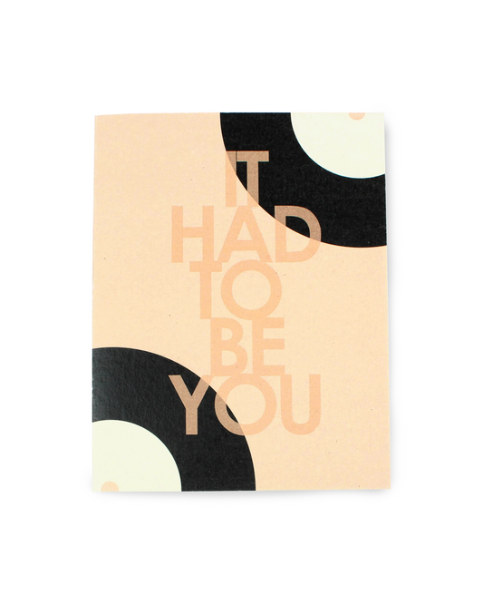 Card with 'IT HAD TO BE YOU' text on a beige background with black and white abstract shapes