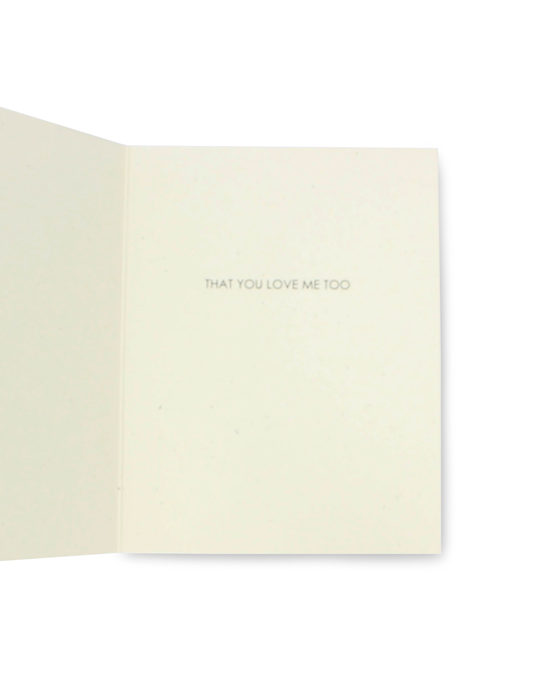 Beige greeting card with 'THAT YOU LOVE ME TOO' text on a white background