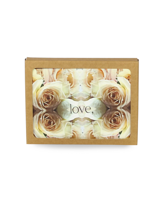 Box of beige roses with a heart and 'love' text on a white background