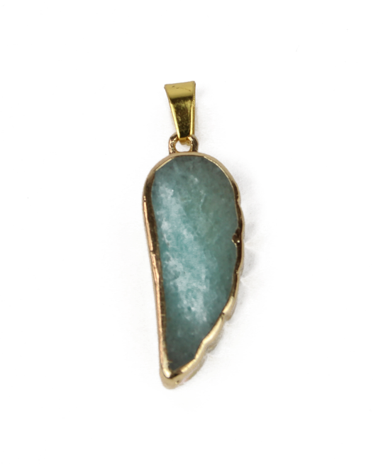 Pendant with green stone and gold frame on a white background