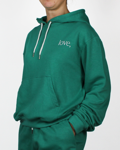 Green hoodie with 'love,' text on a white background