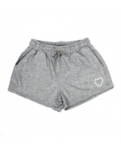 Gray shorts with a heart logo on a white background