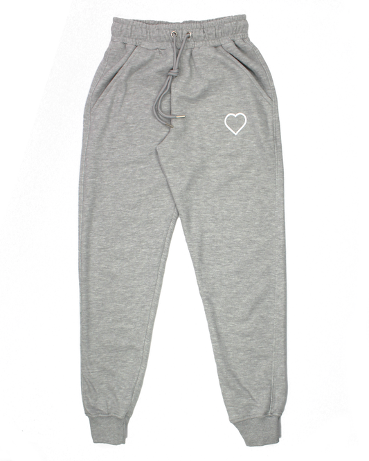 grey sweatpants with heart logo on a white background
