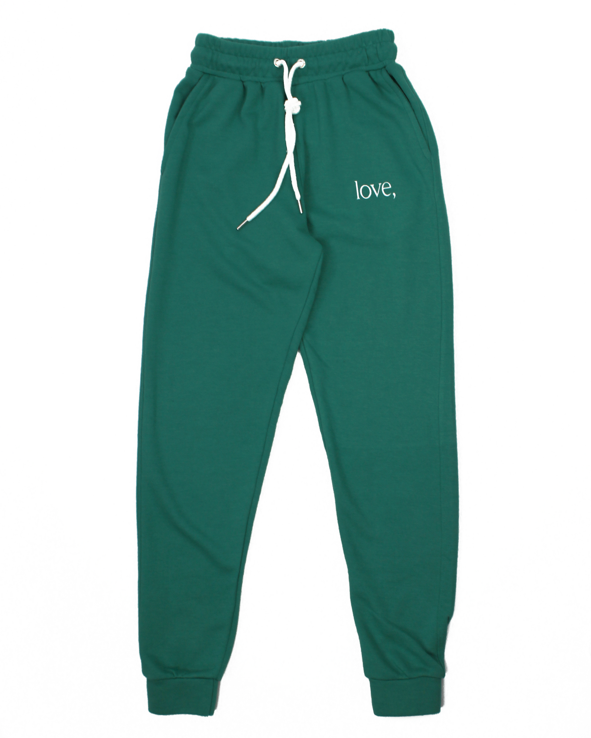 Green sweatpants with 'love,' text on a white background