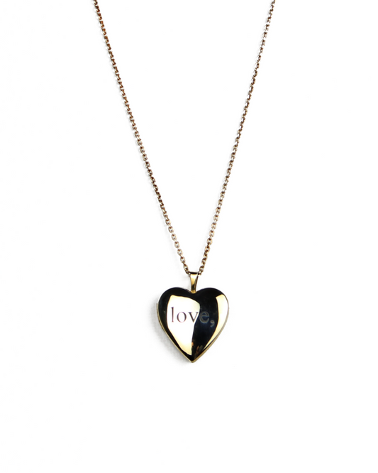 Heart-shaped pendant necklace with 'love,' engraving on a white background