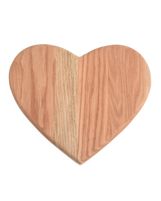Wooden heart-shaped cutting board on a white background