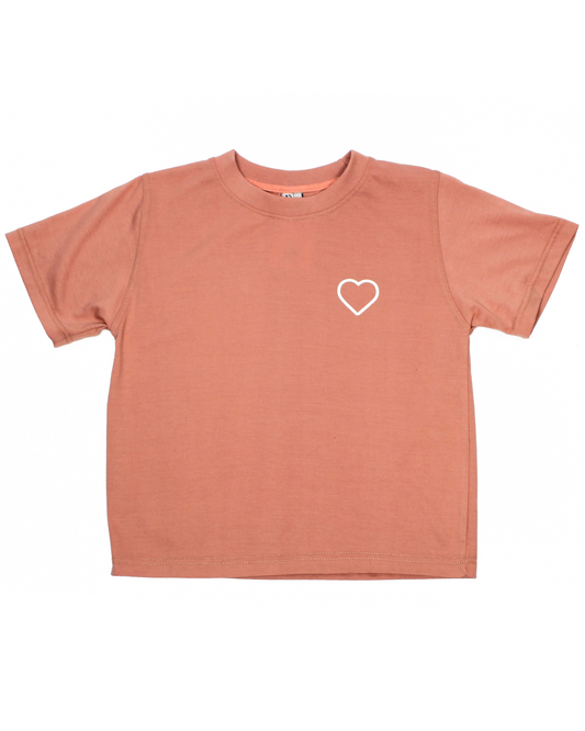 Coral t-shirt with a white heart on a white background