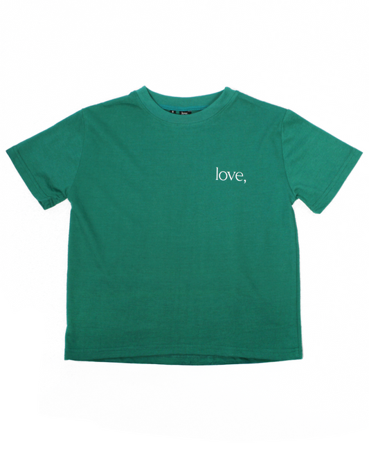 Green t-shirt with 'love,' text on a white background