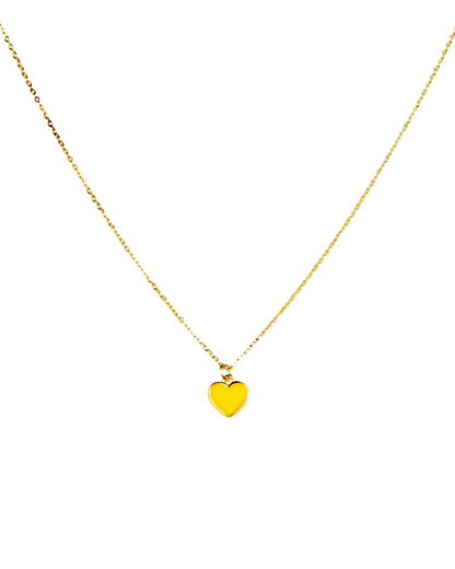 Gold necklace with a heart-shaped pendant on a white background