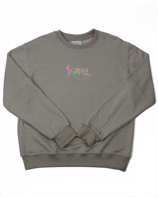 Gray sweatshirt with 'love' embroidered in colorful letters on a white background